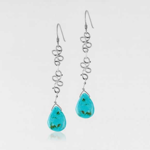 Sterling silver genuine teardrop cut turquoise handcrafted ﻿earrings.