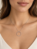 Model wearing a 14K white gold 21 mm open-circle diamond necklace