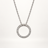 14K white gold natural diamond circle necklace on a pale ivory background