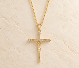 Freya gold-plated CZ crucifix necklace on ivory stone