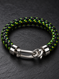 Close-up of the braided leatherette bracelet’s green and yellow threads and stainless steel locking clasp