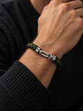 Ebedi braided black leatherette bracelet with green and yellow threads worn on a male model’s wrist