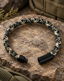 Ebedi camouflage woven acrylic cord bracelet shown open with black IP stainless steel button clasp