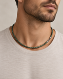 Male model wearing Ebedi woven green and white cord necklace