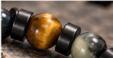 Close-up of tiger eye bead and black jasper disc spacers