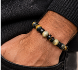 Ebedi tiger eye and black jasper bracelet worn on wrist
