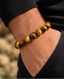 Ebedi 12mm tiger eye bracelet worn on wrist with clasp positioned out of view
