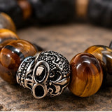 Close-up of tiger eye beads and silver-plated skull detail