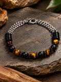 Ebedi tiger eye, black onyx and stainless steel chain bracelet on slate