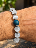 White cat’s eye and blue druzy quartz bracelet worn on wrist