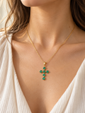 Freya green CZ cross necklace worn by a model