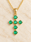 Close-up of Freya green CZ cross necklace pendant