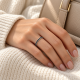 Black pavé CZ sterling silver ring worn on a model's hand