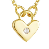 Close-up of gold-plated heart pendant with single CZ stone