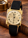Gruen Precision Swiss vintage watch, original square gold-plated case and champagne dial, styled front photograph