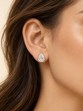 Model wearing a pear-shaped moissanite stud earring