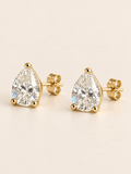 Pear-shaped moissanite studs showing the gold setting and posts