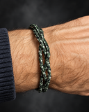 Triple-braided camouflage cord bracelet worn on wrist