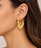 Folded gold IP stainless steel hoop earring worn on ear