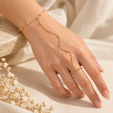 Model wearing the delicate gold-plated silver hand bracelet on hand and wrist