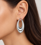 Silver stainless steel nested hoop earring worn on ear