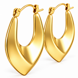 Close-up of smooth gold IP stainless steel hoop earrings