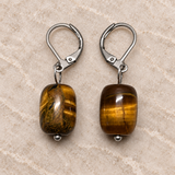 Tiger Eye earrings on a styled studio background