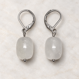 White Quartz earrings on a styled studio background