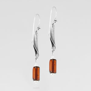 Sterling ﻿silver flow  juxtaposed with natural amber, handcrafted earrings
