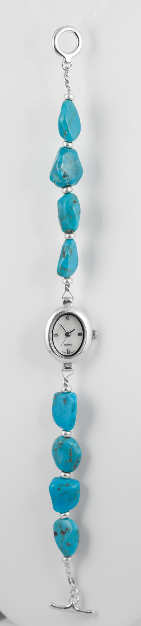 Sterling silver handcrafted watch strung with genuine roughly cut turquoise.